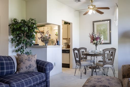 A dining area in a two-bedroom unit at Hawthorne Apartment Homes, featuring a table and chairs for meals and gatherings.
